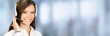 Call Center Service. Face portrait of customer support or answer worker, sales agent. Caller, advertiser, receptionist phone operator. Helpline answering and telemarketing. Wide banner composition.の写真素材