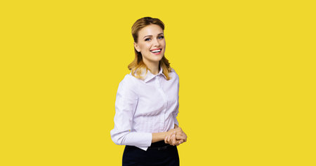 Happy smiling attractive businesswoman, with copy space area for some slogan or text. Confident...