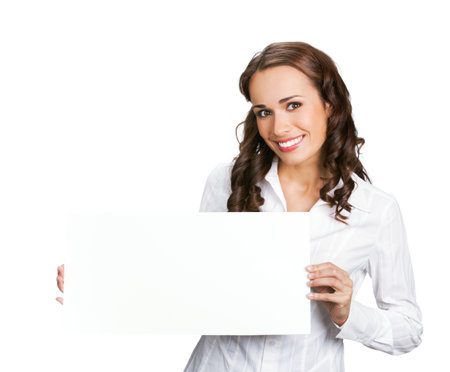 Happy smiling brunette business woman in confident clothing, holding showing empty sign banner or mock up signboard with copy space text area, isolated on white background.の写真素材