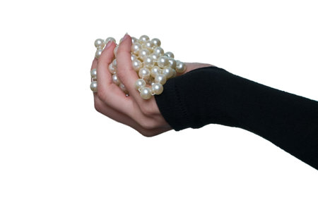 pearls in the woman's handの写真素材