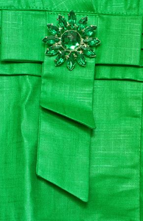 green dress with luxury brooch as a sing of  fashionの写真素材