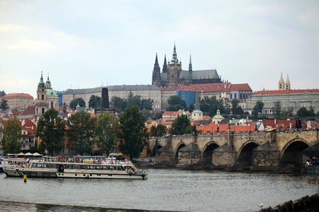 Prague castle with Charles bridge over the river Vltava and shipのeditorial素材