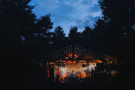 wooden pavilion for a wedding in the forest. wedding at dinner.の写真素材