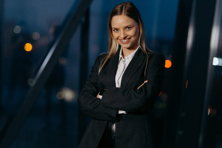 a business woman in a classic suit is looking at the camera.