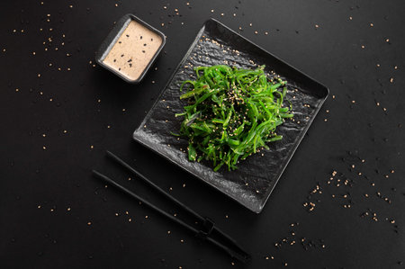 Wakame seaweed salad with sesame seed. Traditional Japanese food.
