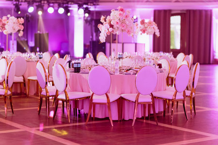 Luxury decorated with flowers roses and orchids celebration hall in palace. banquet hall for a wedding.の写真素材