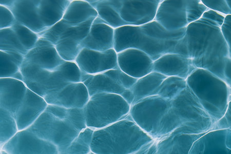 pool water background. texture of blue water in the pool