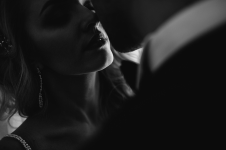 Bride and groom at the wedding Day. Wedding couple, happy newlywed woman and man, in a beautiful hotel room, studio. Loving couple. Bride and groomの写真素材