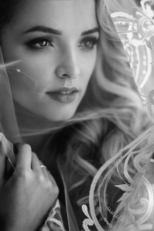 Fashionable and modern bride, beautiful blonde girl, smiling with happiness and loveの写真素材