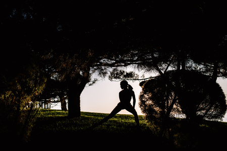 beautiful girl with sports forms sports on the beachの写真素材