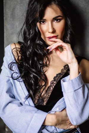 Portrait of beautiful female model on gray backgroundの写真素材