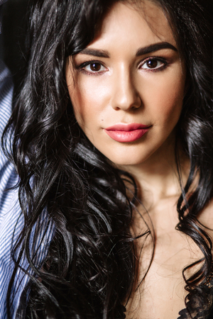 Portrait of beautiful female model on gray backgroundの写真素材