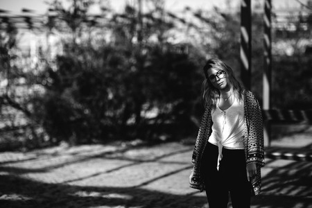 Blonde girl on the beach of the sandy beach by the sea.の写真素材