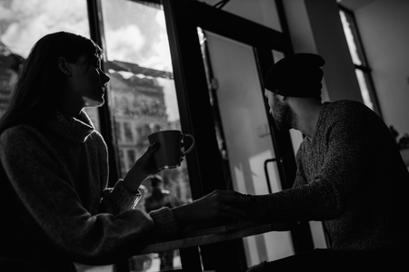 Two cheerful young loving people who drank coffee at coffee shopsの写真素材
