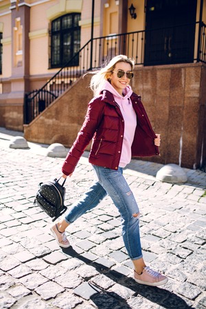 Stylish hipster girl in the retro jeans suitの写真素材