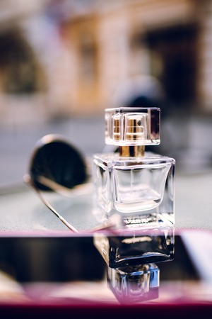 Perfume bottle on wooden surfaceの写真素材