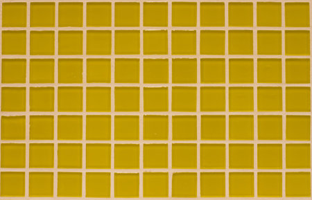 Gradient yellow colored mosaic background tiles