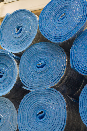 Insulation material in rolls for sale on a store shelfの写真素材