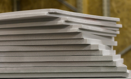 polystyrene slabs lie a tower close-up of gray color. heat insulation for homeの写真素材