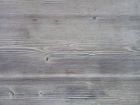 Gray wooden boards assembled in one canvas. Wood texture, timber. Close-up, selective focus, background.の写真素材