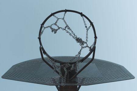 Metallic basketball hoop, basket against blue sky. Outdoor basketball court. Sky board.