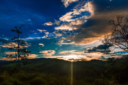 BEAUTIFUL SUNSET OVER THE FIELDS AND MOUNTAINS OF COLOMBIA