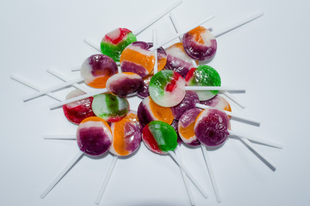 SWEET LOLLIPOPS ON WHITE BACKGROUNDの写真素材