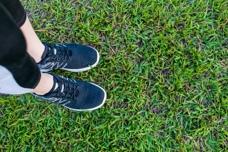 FEET WITH TENNIS ON GRASSの写真素材
