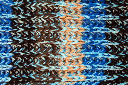 Closeup of blue knitted wool texture. Wool background.