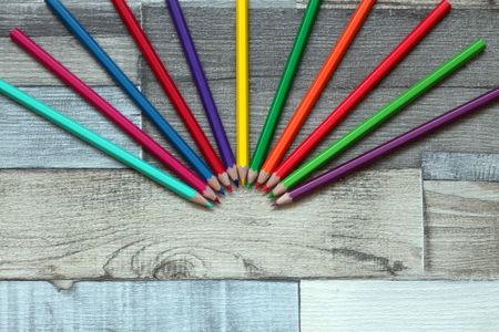 Color pencils on wooden backgroundの写真素材