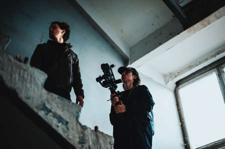 Team looking for good shoot on deserted stairsの写真素材