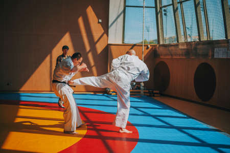 Bald man hard strikes opponent on tatamiの写真素材