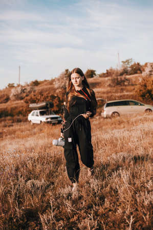 Pretty girl on a field with megaphoneの写真素材