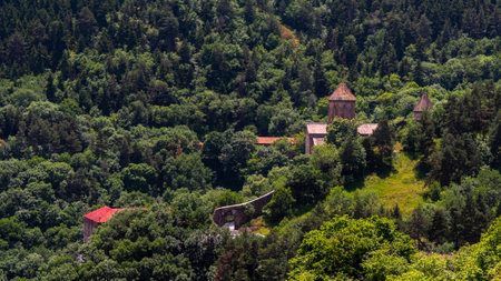 Old red church lost in the mountain forestの写真素材