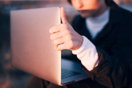 Close-up of girl who opens the laptopの写真素材