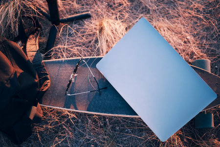 Skateboard, Laptop, Sunglasses, Backpack outdoorsの写真素材