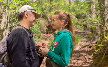 Smiling father holds a daughters handの写真素材