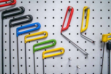 Bright colored special hooks using in PDR work process to remove dents on a standの写真素材