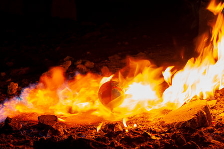 Globe in fire circle in abandoned space. Parallel to 2020 year news in world conceptの写真素材