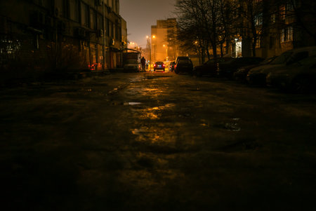 A dark street in the city at the nightの写真素材