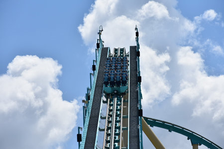 Orlando, Florida. September 21, 2018. Amusement Kraken roller coaster with funny riders on cloudy...