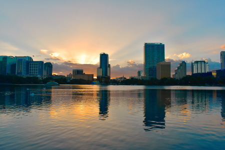 Orlando, Florida. October 16, 2018 Downtown Orlando buildings in front of Eola Lake Park on beautiful sunset.のeditorial素材