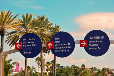 Orlando, Florida; August 15, 2018 Universal Studios Theme Parks Signs, whith cloudy blue sky.のeditorial素材