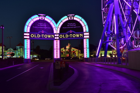 Orlando, Florida; October 31, 2018 Colofur Arches and Ferris Wheel at night in Old Town Kissimmee.のeditorial素材