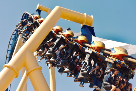 Tampa, Florida. October 25, 2018 People ride giant Montu Roller Coaster at Bush Gardens Tampa Bay. Several are screaming.のeditorial素材
