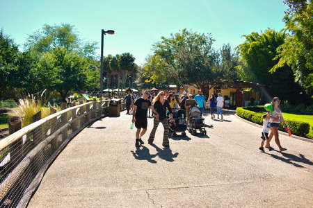 Tampa, Florida. October 25, 2018 People walking at evening in Park street on lightblue sky background at Bush Gardens Tampa Bay.のeditorial素材