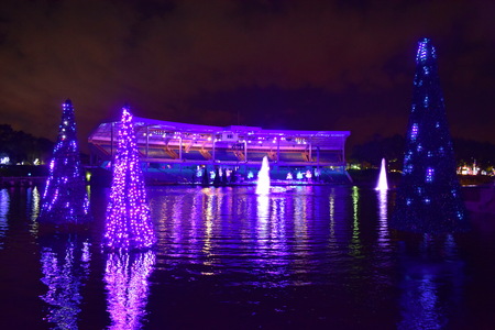 Orlando, Florida. November 17, 2018. Colorful Stadium and Illuminated Christmas trees reflected in the water in International Drive area.のeditorial素材