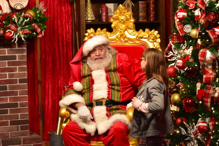 Orlando, Florida; November 24, 2018. Cute little Girl talking to Santa Claus in International Drive area.のeditorial素材