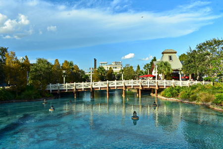 Orlando, Florida. November 24, 2018 View of bridge, lamps floating above lake on lightblue cloudy background at Lake Buena Vista.のeditorial素材