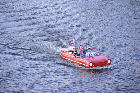 Orlando, Florida. November 07, 2018 Nice family enjoying Amphibious red car ride over the blue lake at Lake Buena Vista areaのeditorial素材